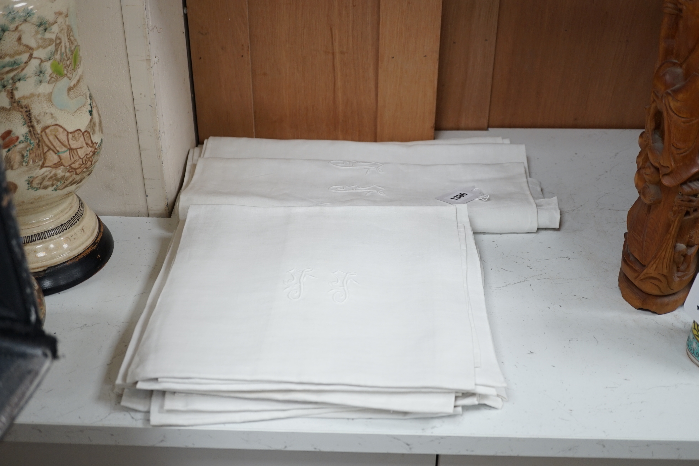 A French monogrammed linen refectory tablecloth and twelve matching dinner size napkins